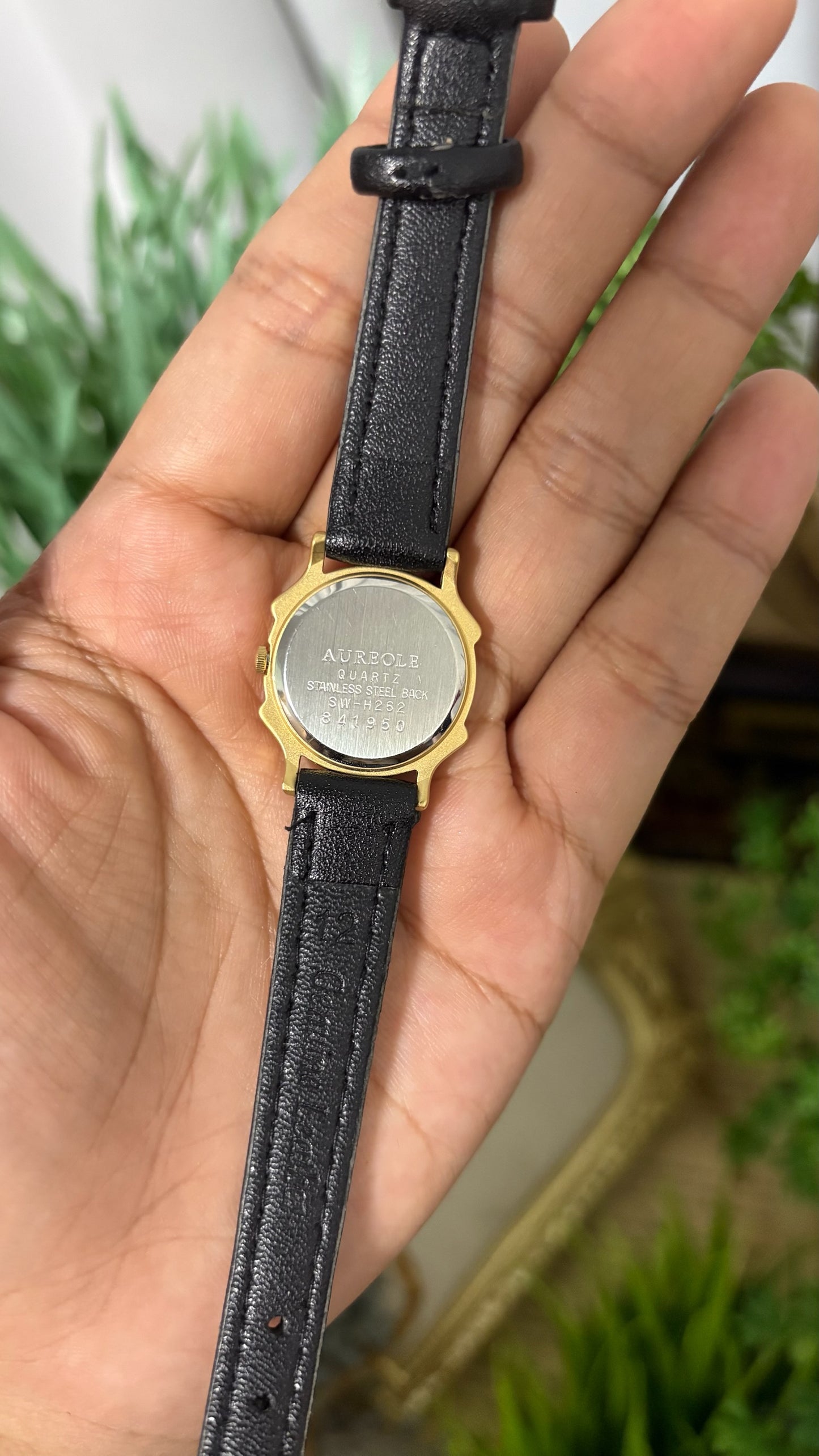 Vintage Aureole Round Watch with Champagne Dial Gold Tone Stylized Notched Case Roman Numerals at XII and VI and Smooth Slim Black Leather Strap Quartz