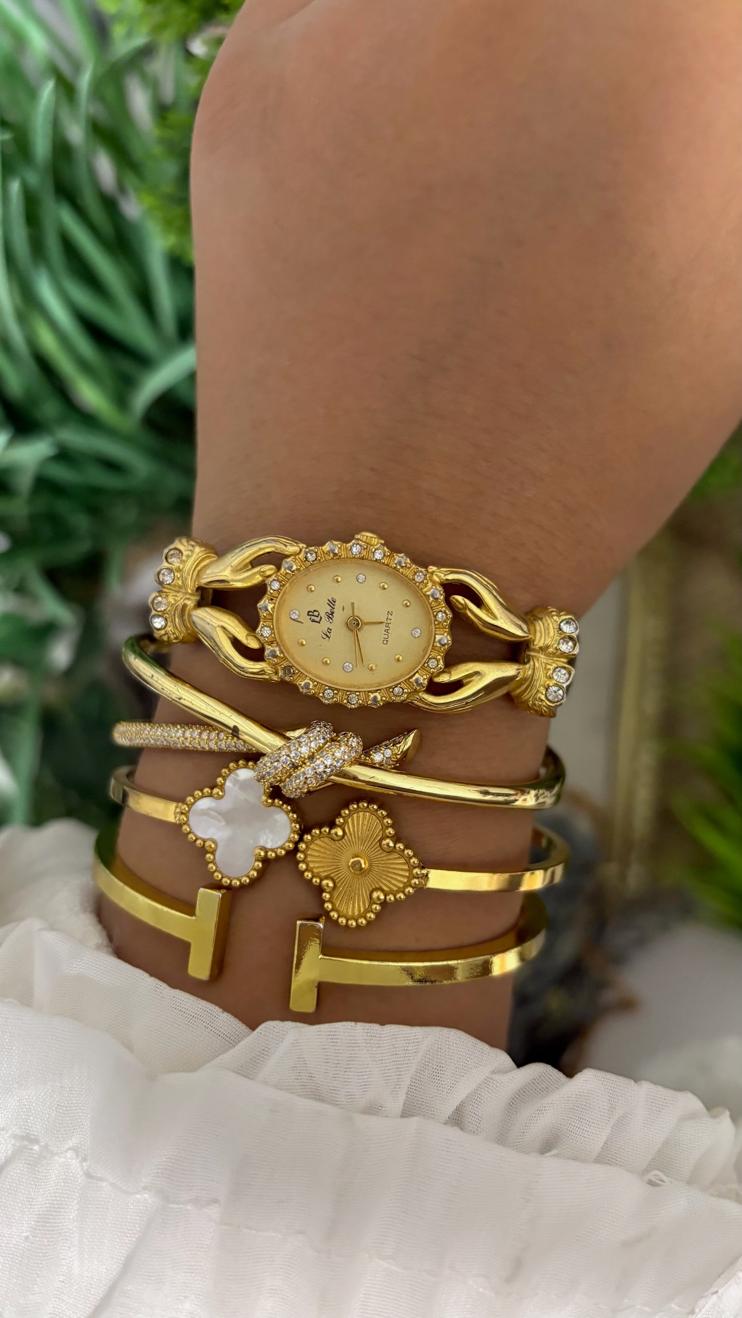 Vintage La Belle Oval Watch with Gold Tone Dial Crystal Halo Bezel Ornate Hands Shape Case Accents and Crystal Set Bow End Links Quartz