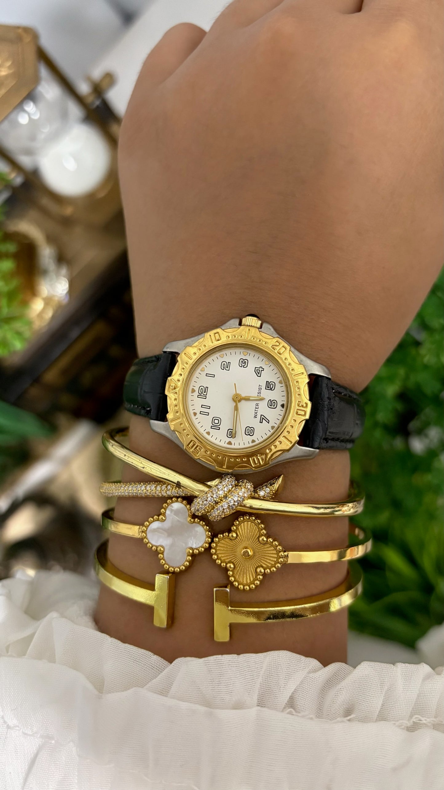 Vintage Noevir Round Sporty Watch with White Dial Full Arabic Numerals Gold Tone Rotating Style Bezel Two-Tone Silver and Gold Case and Black Croc Embossed Leather Strap Quartz