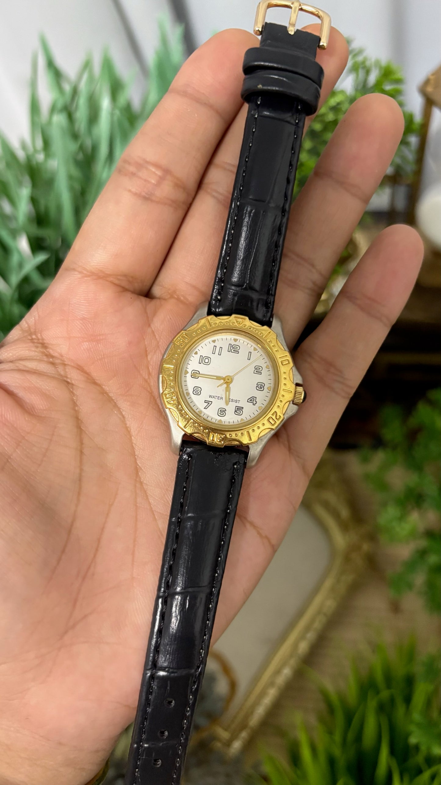 Vintage Noevir Round Sporty Watch with White Dial Full Arabic Numerals Gold Tone Rotating Style Bezel Two-Tone Silver and Gold Case and Black Croc Embossed Leather Strap Quartz