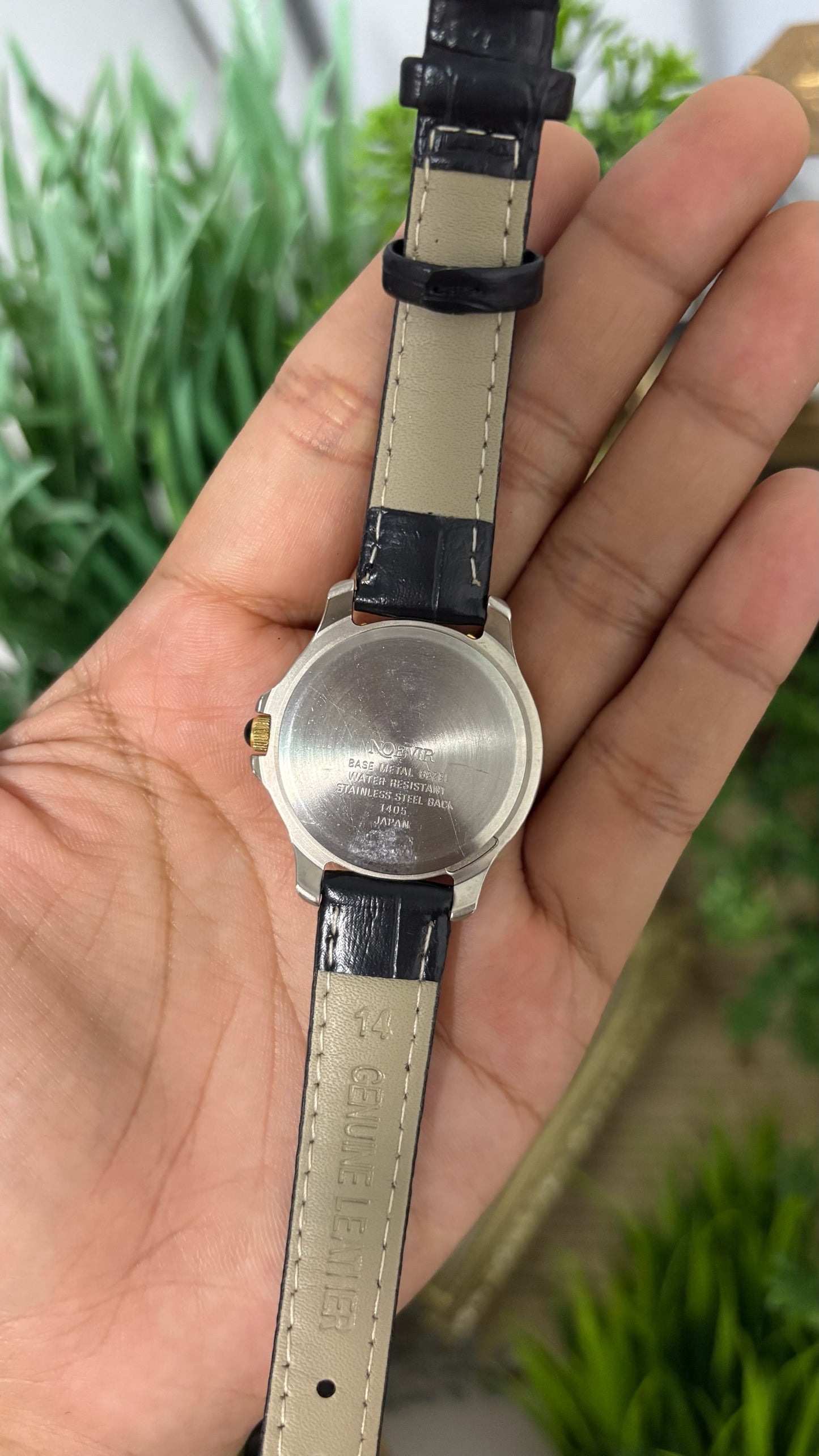 Vintage Noevir Round Sporty Watch with White Dial Full Arabic Numerals Gold Tone Rotating Style Bezel Two-Tone Silver and Gold Case and Black Croc Embossed Leather Strap Quartz