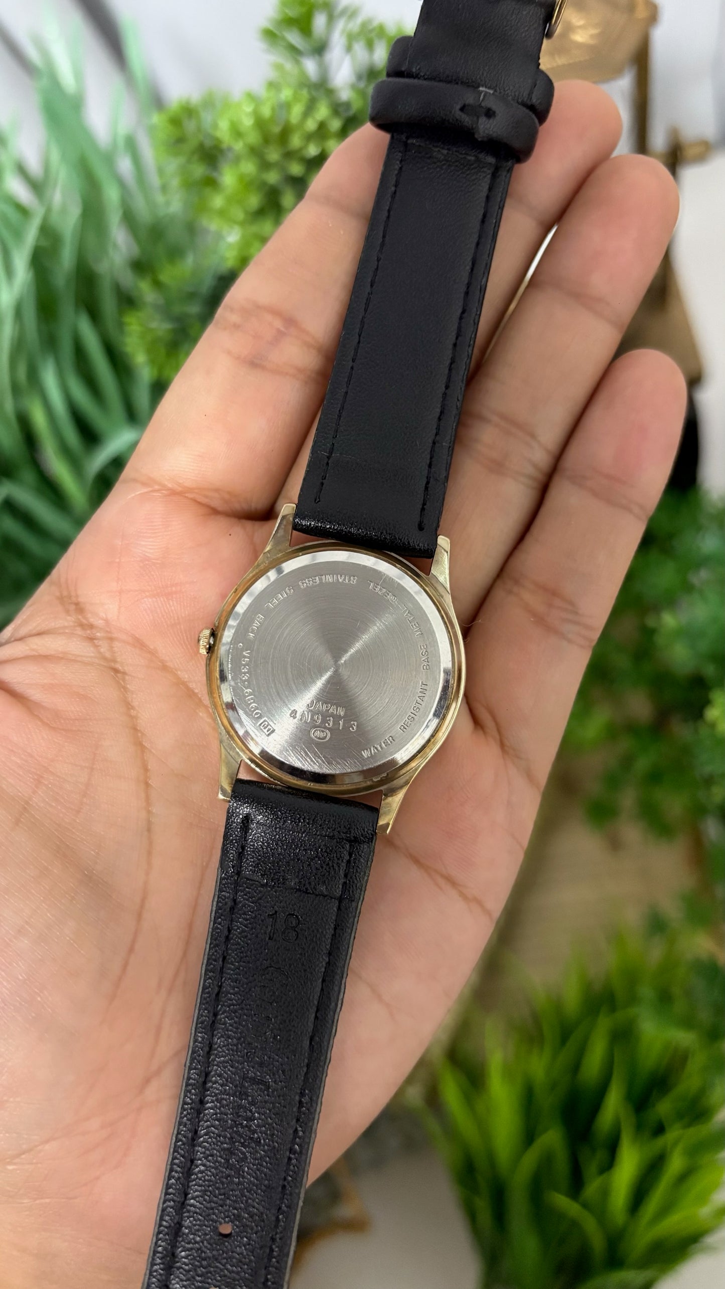 Vintage Philip Morris Super Lights Mens Round Watch with White Dial Full Arabic Numerals Day Date Window Polished Gold Tone Case and Smooth Black Leather Strap Quartz