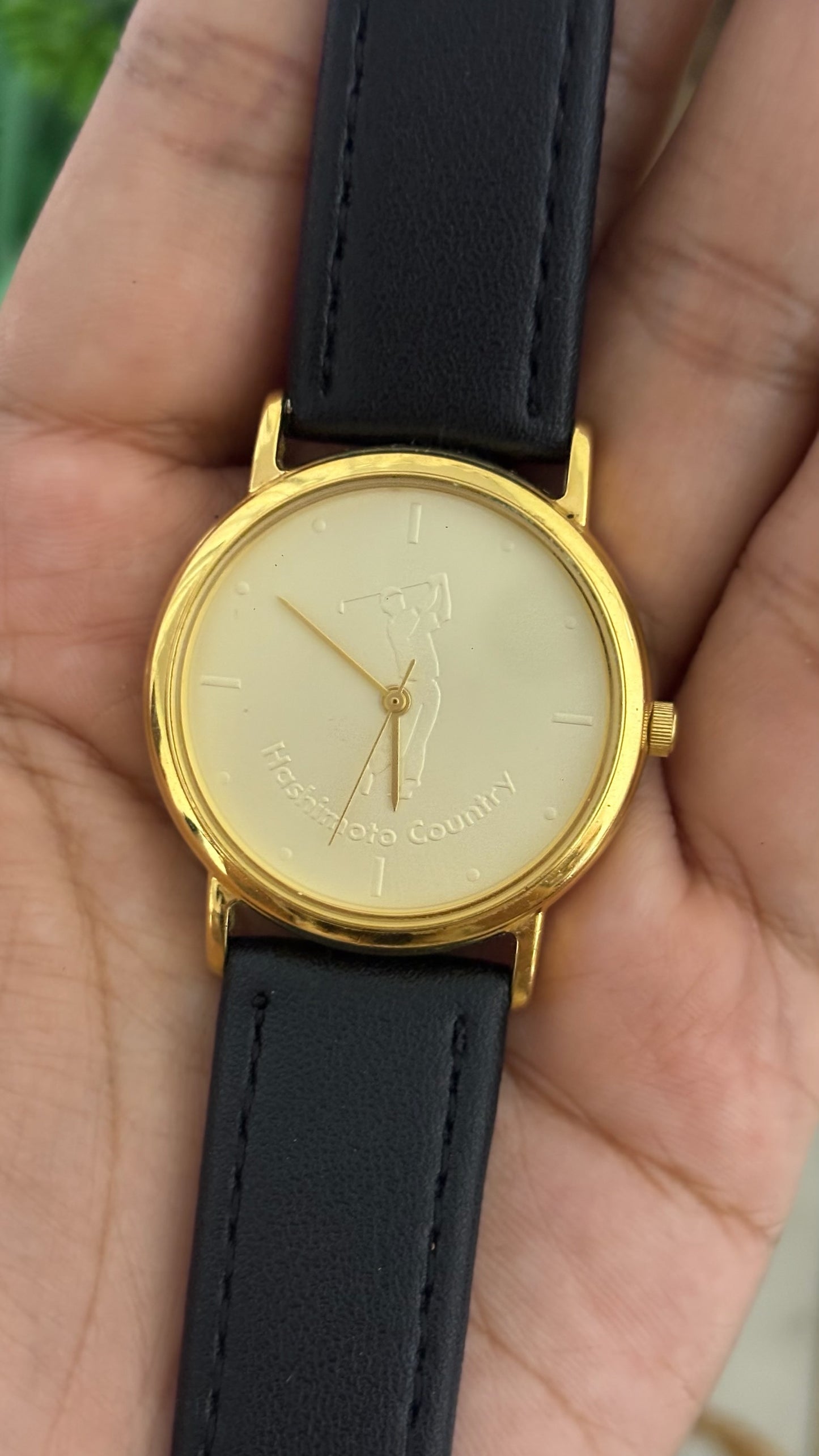 Vintage Citizen Hashimoto Country Mens Round Golf Watch with Champagne Dial Engraved Golfer Silhouette Polished Gold Tone Case and Smooth Black Leather Strap Quartz