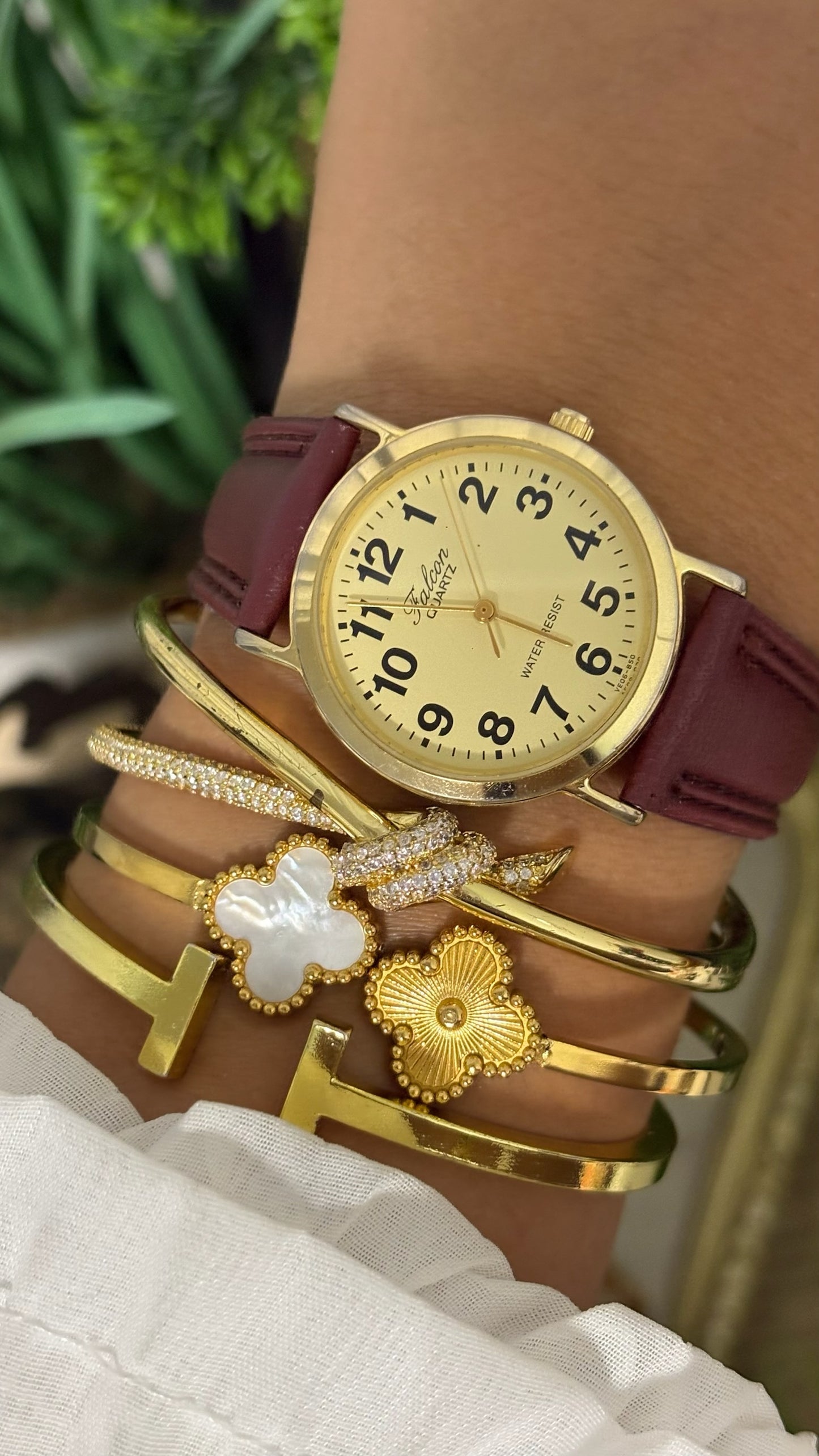 Vintage Q&Q Falcon Mens Round Watch with Champagne Dial Full Arabic Numerals Polished Gold Tone Case and Smooth Maroon Leather Strap Quartz