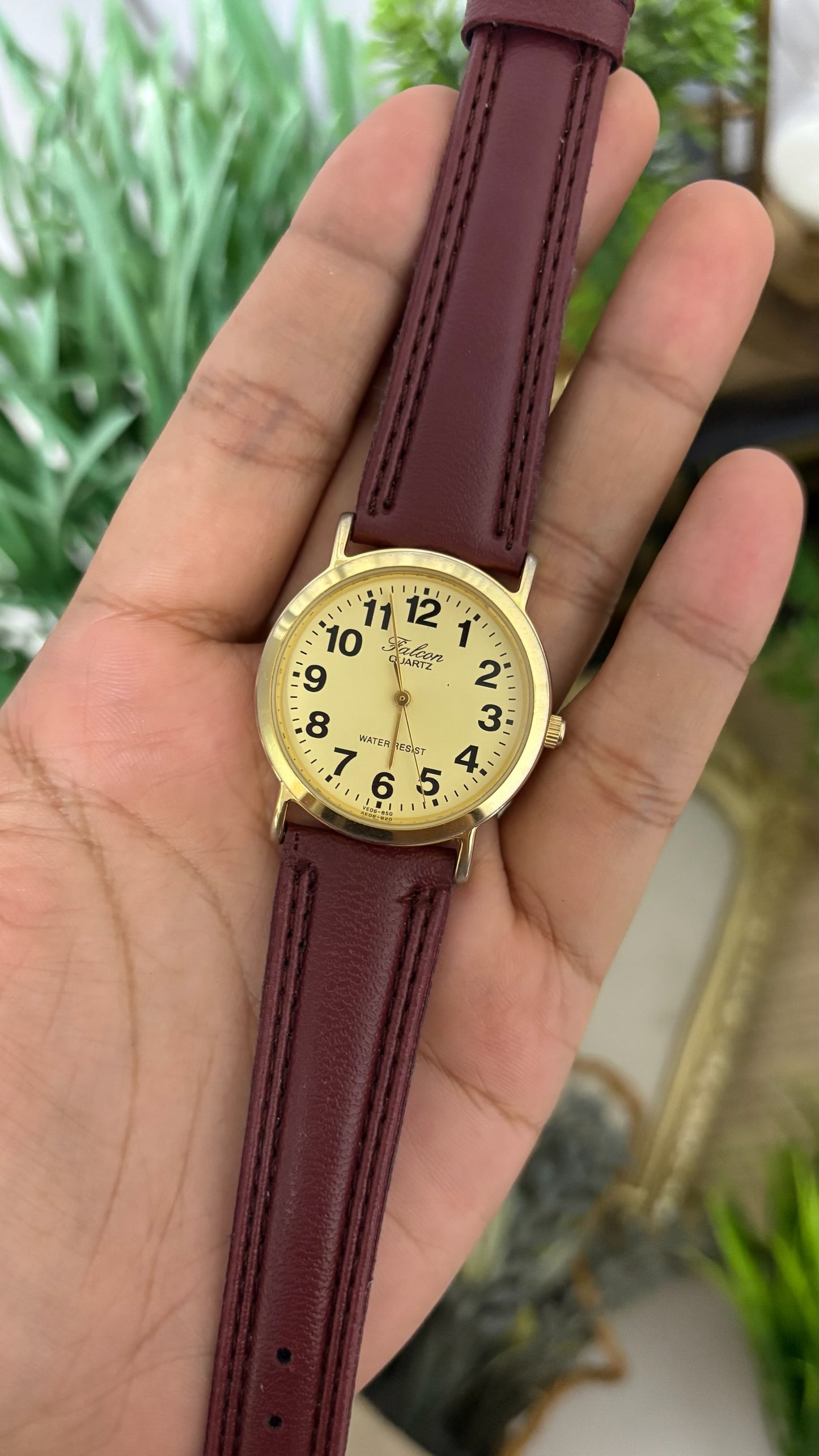 Vintage Q&Q Falcon Mens Round Watch with Champagne Dial Full Arabic Numerals Polished Gold Tone Case and Smooth Maroon Leather Strap Quartz