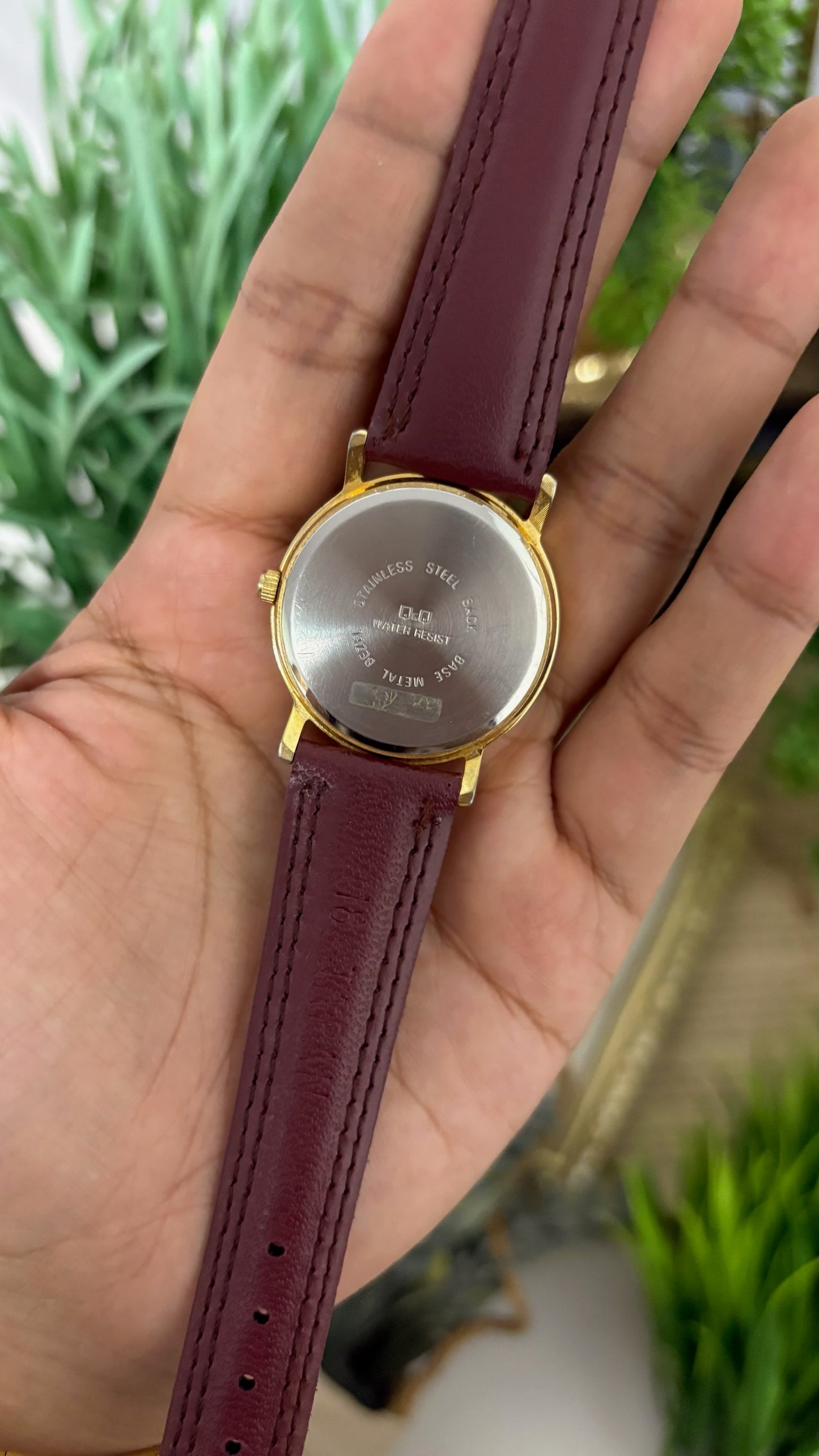 Vintage Q&Q Falcon Mens Round Watch with Champagne Dial Full Arabic Numerals Polished Gold Tone Case and Smooth Maroon Leather Strap Quartz