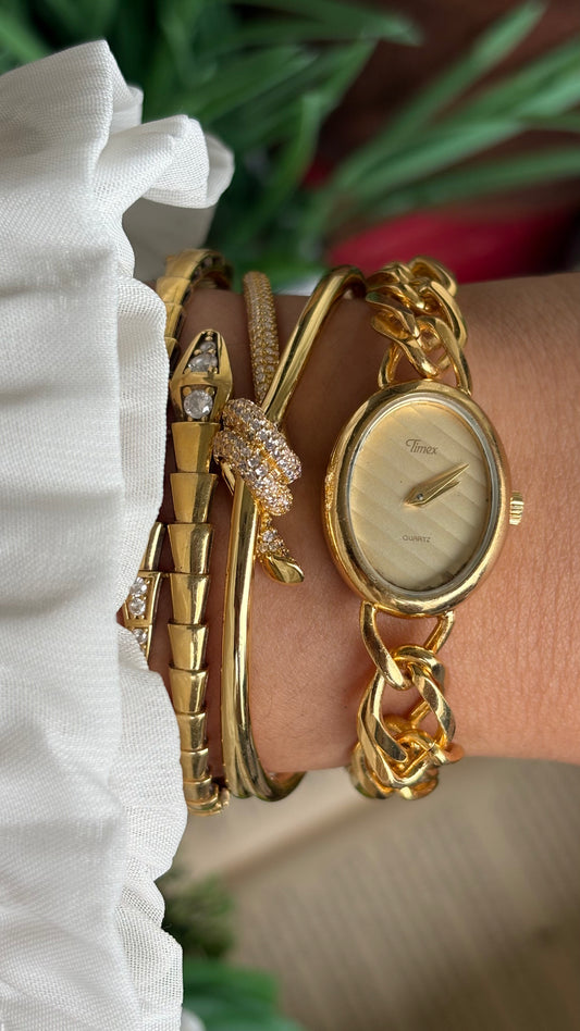 Vintage Timex Bracelet Watch in Gold Tone Oval Face Textured Dial