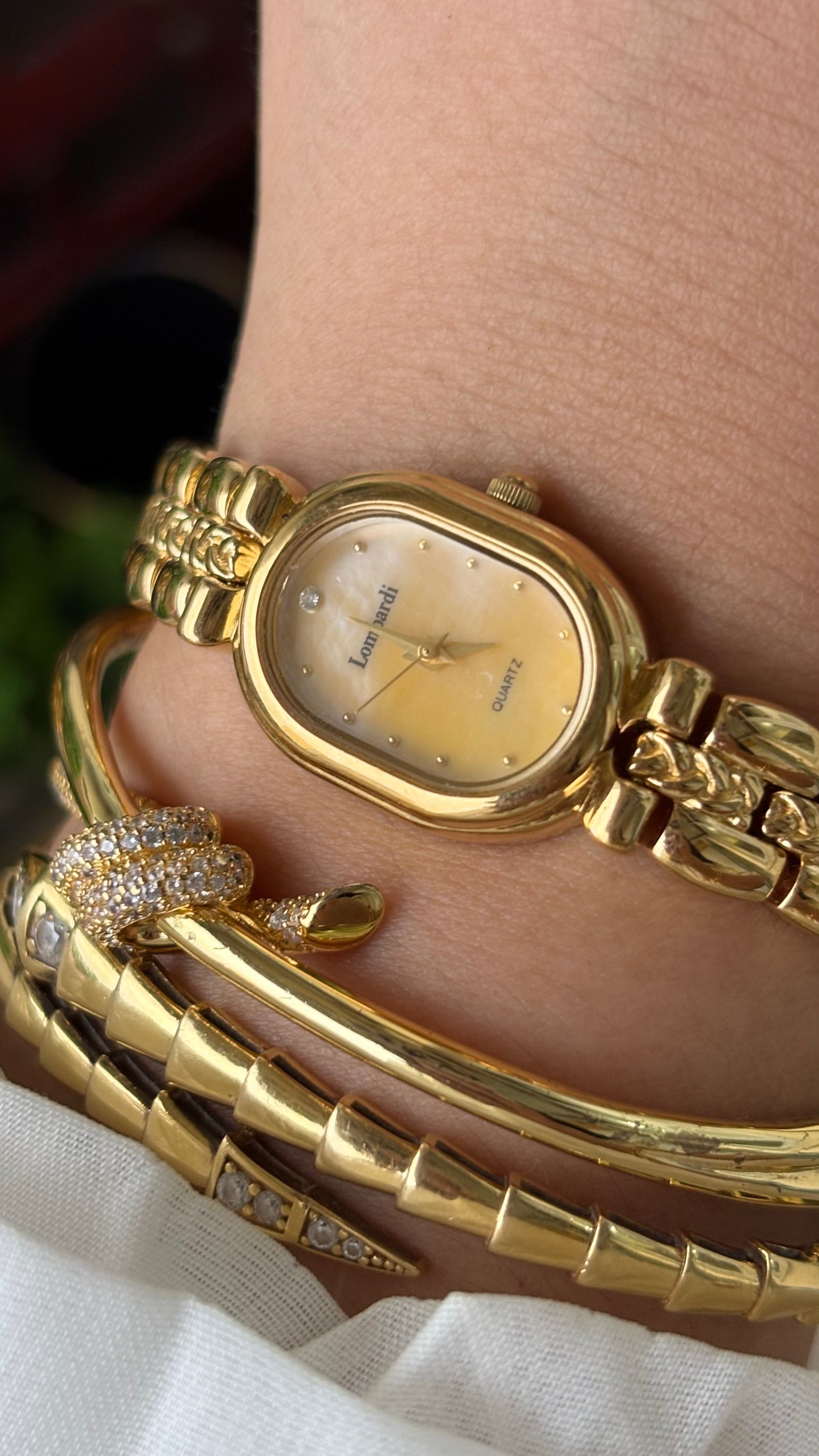 Vintage Lombardi Watch in Gold Tone Mother of Pearl Oval Dial Quartz