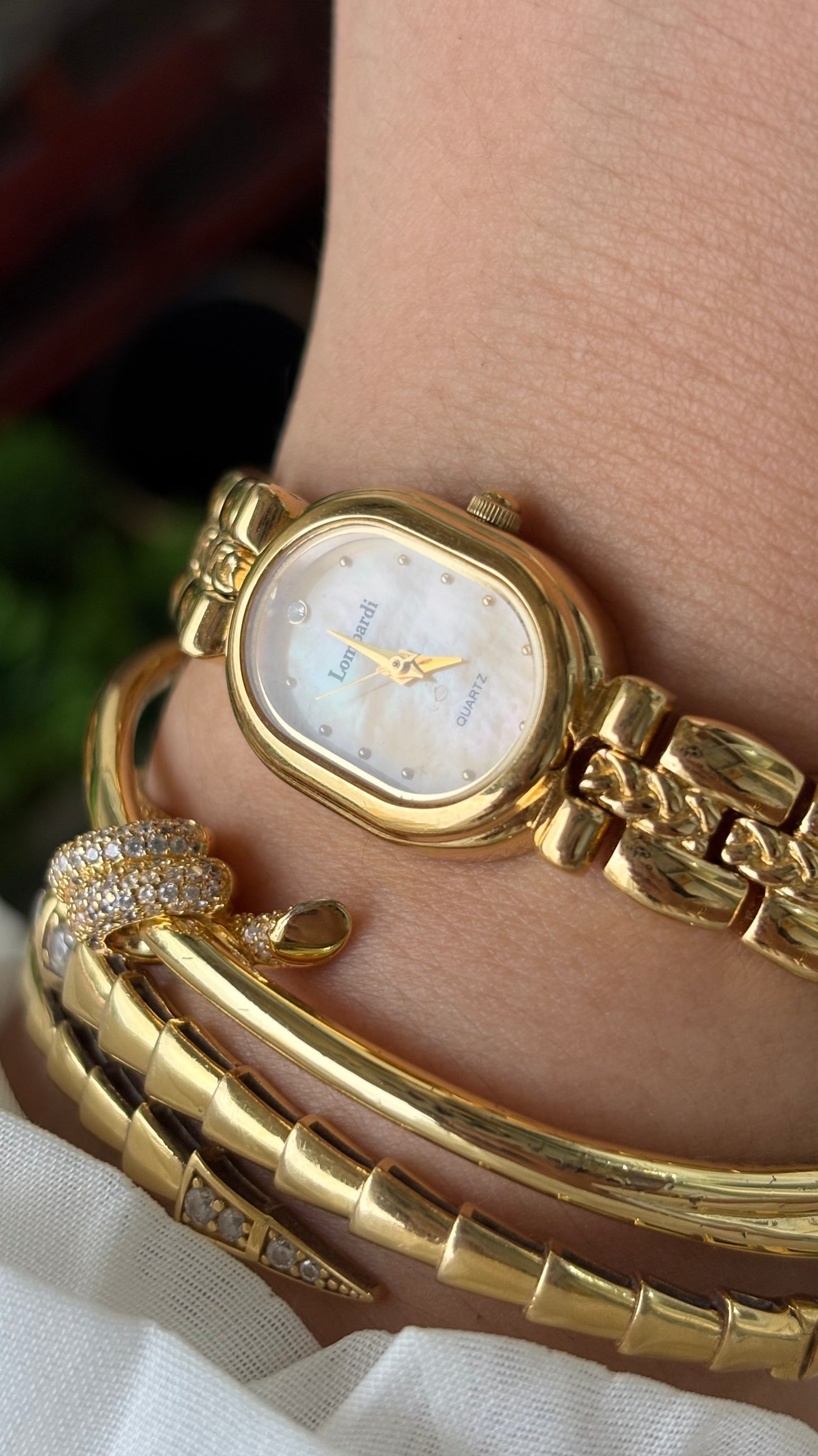 Vintage Lombardi Watch in Gold Tone Mother of Pearl Oval Dial Quartz